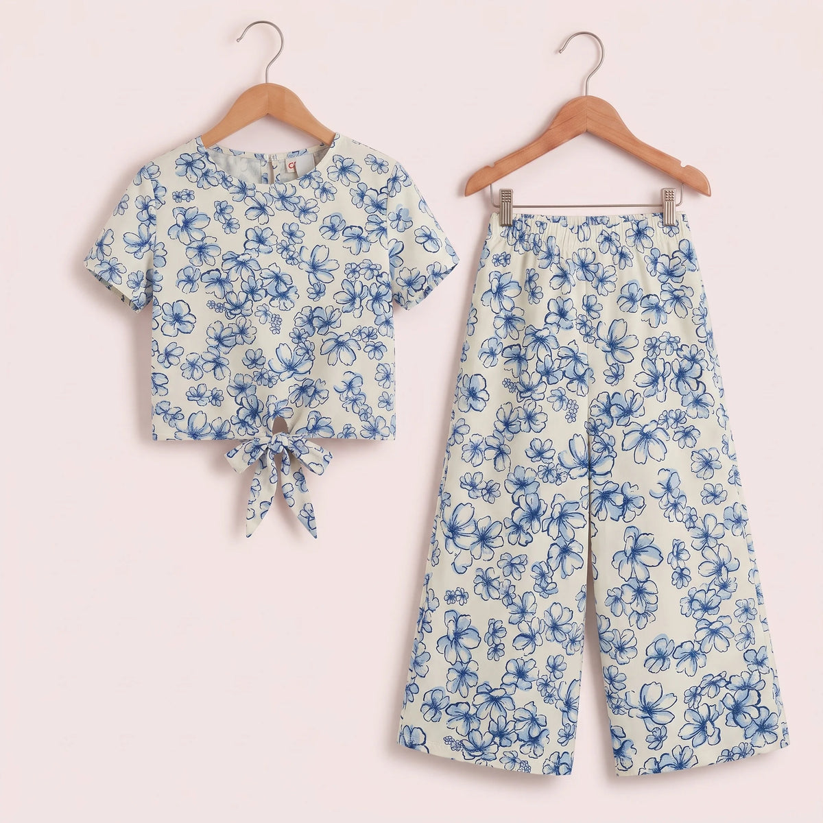 Floral print cropped top and wide-leg pants set for girls, featuring blue spring blossom design. Perfect for casual wear.