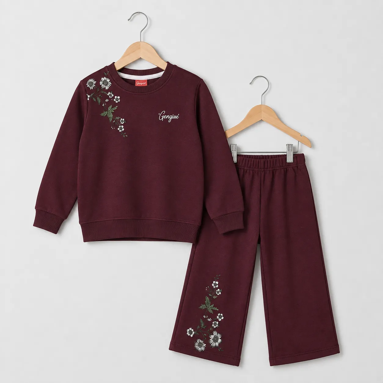 Terry maroon floral print tracksuit for girls, featuring an embroidered sweatshirt and matching pants.